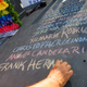Edwin Rodriguez writes the names of the victims of the Pulse nightclub shooting in front of the nightclub building June 21, 2016, in Orlando, Fla. (Gerardo Mora/Getty Images)